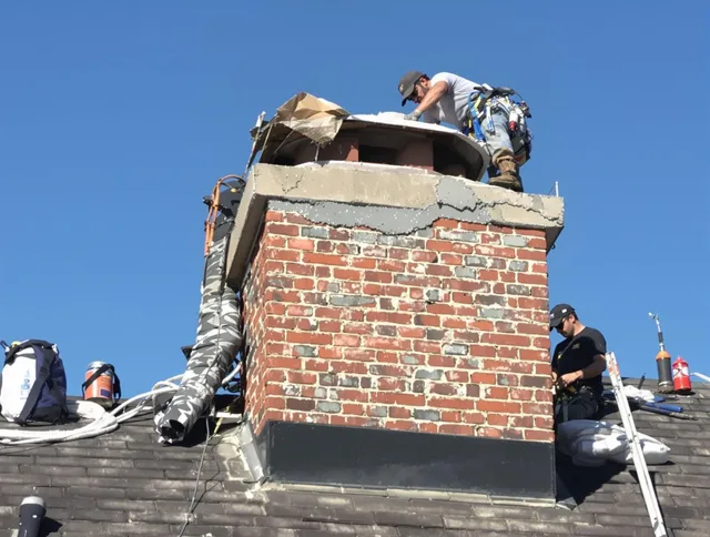 Pooler Chimney Sweep installing a custom chimney crown in Pooler, GA