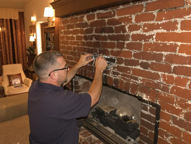 Pooler Chimney Sweep expert fixing a fireplace in Pooler, GA